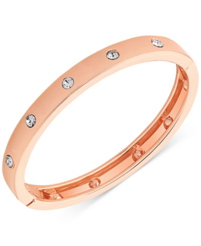 GUESS браслет с шарниром в цвете Rose Gold и прозрачными камнями